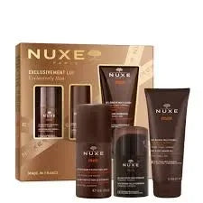 NUXE Men Exclusively Him skincare gift set with four brown bottles, product box in background, from Goldfarmaci Albania.