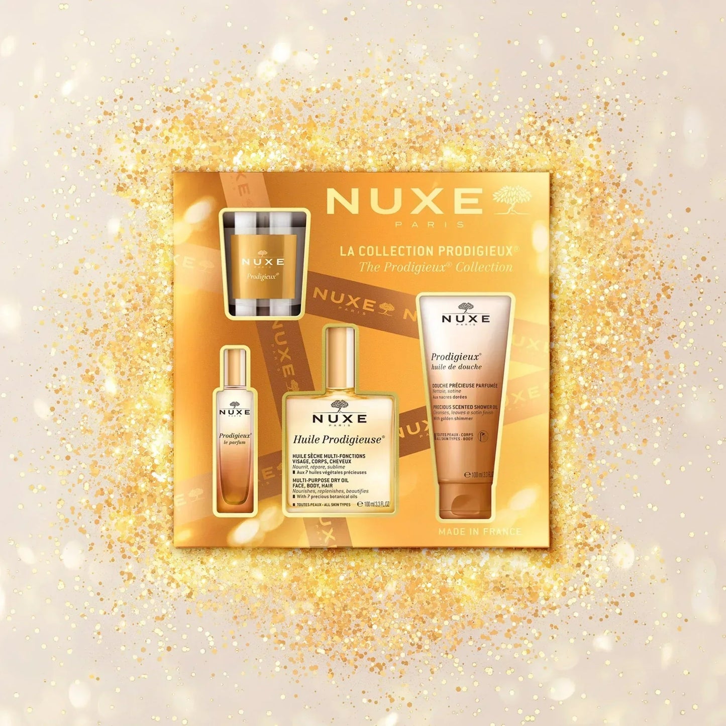 Nuxe Prodigieux Collection skincare set on gold sparkling background at Goldfarmaci online pharmacy