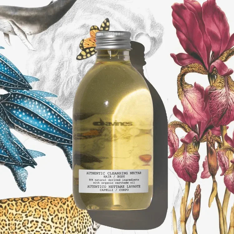 Clear bottle of cleansing nectar for hair and body with illustrated animals and flowers background