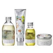 Set of Davines Authentic Moisturising Balm hair and skin care products with floral labels