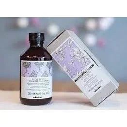 Davines Calming Shampoo bottle and box with lavender label for sensitive scalp care