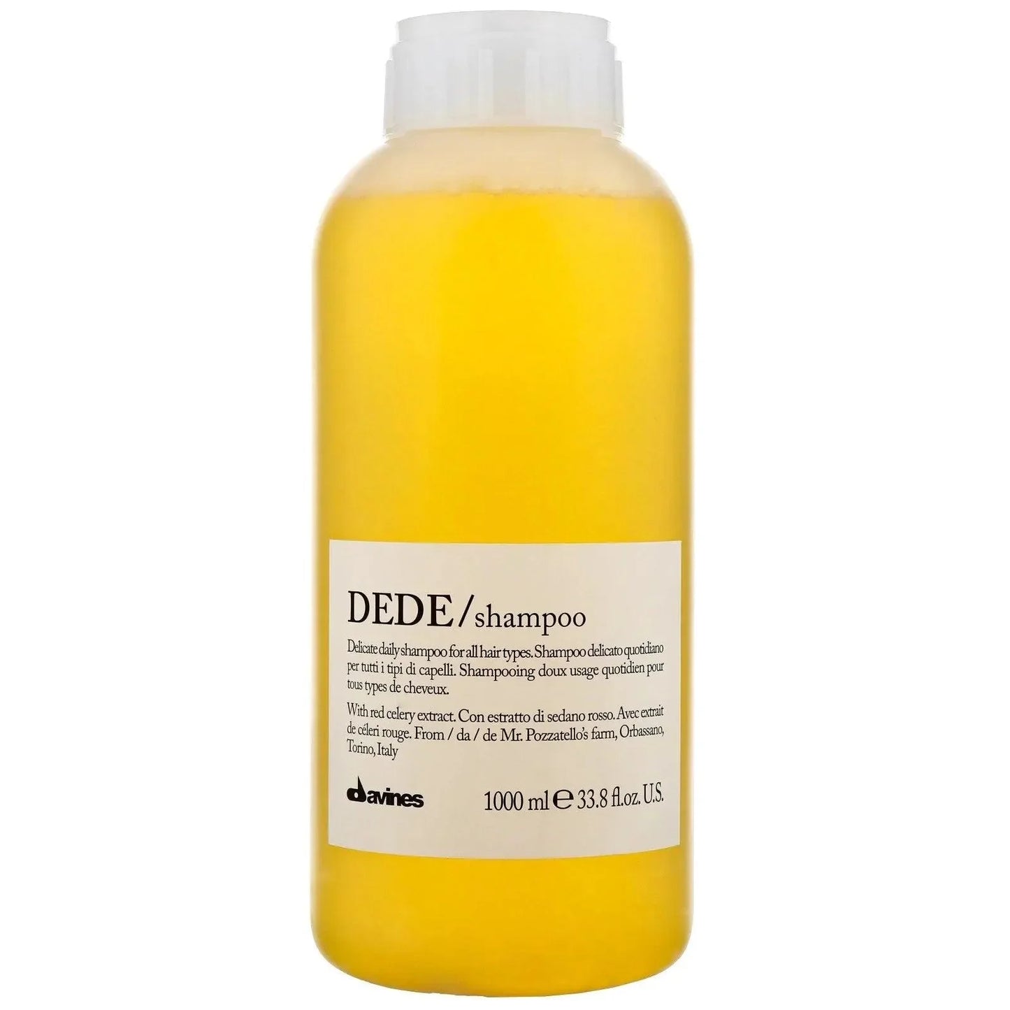 Clear bottle of DEDE shampoo for daily hair care, 1000ml, with yellow liquid and white label.