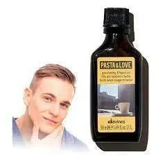 Davines Pasta & Love pre-shaving beard oil bottle beside man touching his smooth face