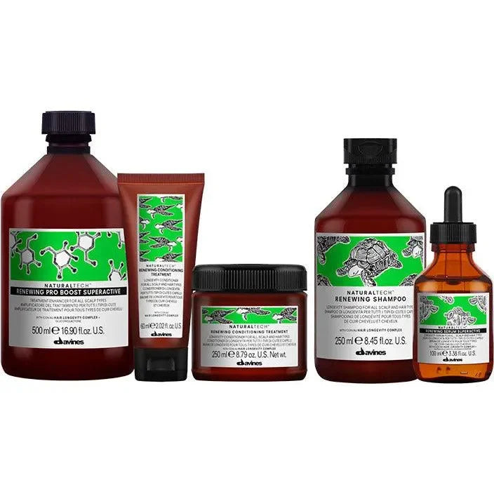 Davines Naturaltech Renewing haircare products set including shampoo, conditioner, and treatment bottles with green labels.