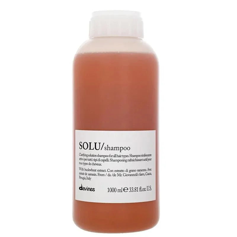 Davines SOLU clarifying shampoo bottle with white label, suitable for all hair types
