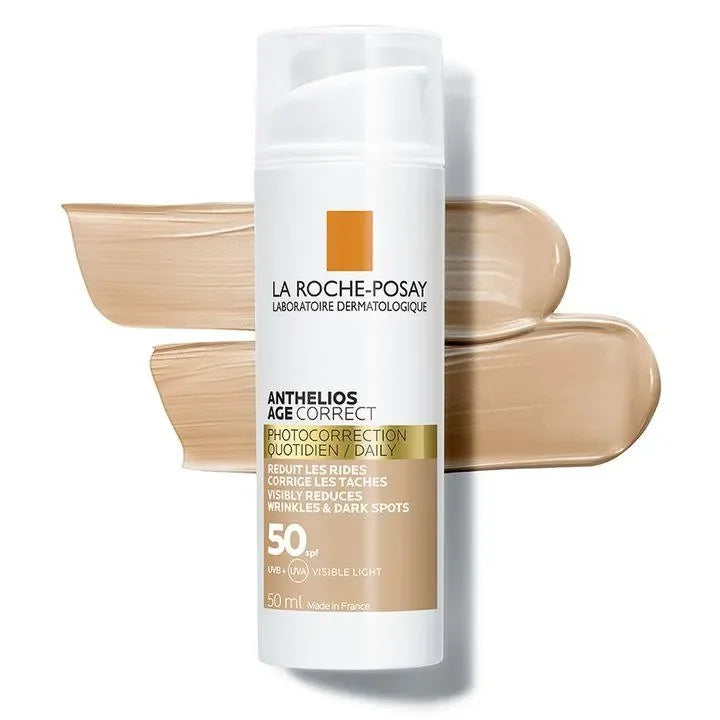Anthelios Age Correct tinted SPF 50 sunscreen bottle with beige cream swatches