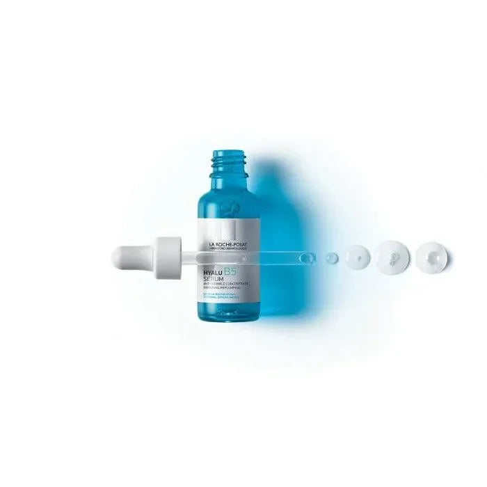 Blue serum bottle with dropper and liquid drops on white background, labeled Hyalu B5 Serum.