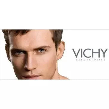 Close-up of man’s face with clear skin and Vichy Laboratoires logo, skincare product visual
