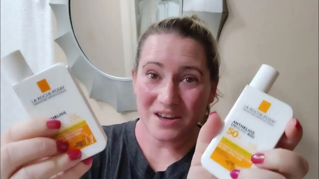Woman holding La Roche-Posay Anthelios sunscreen bottles in a bathroom, Goldfarmaci skincare