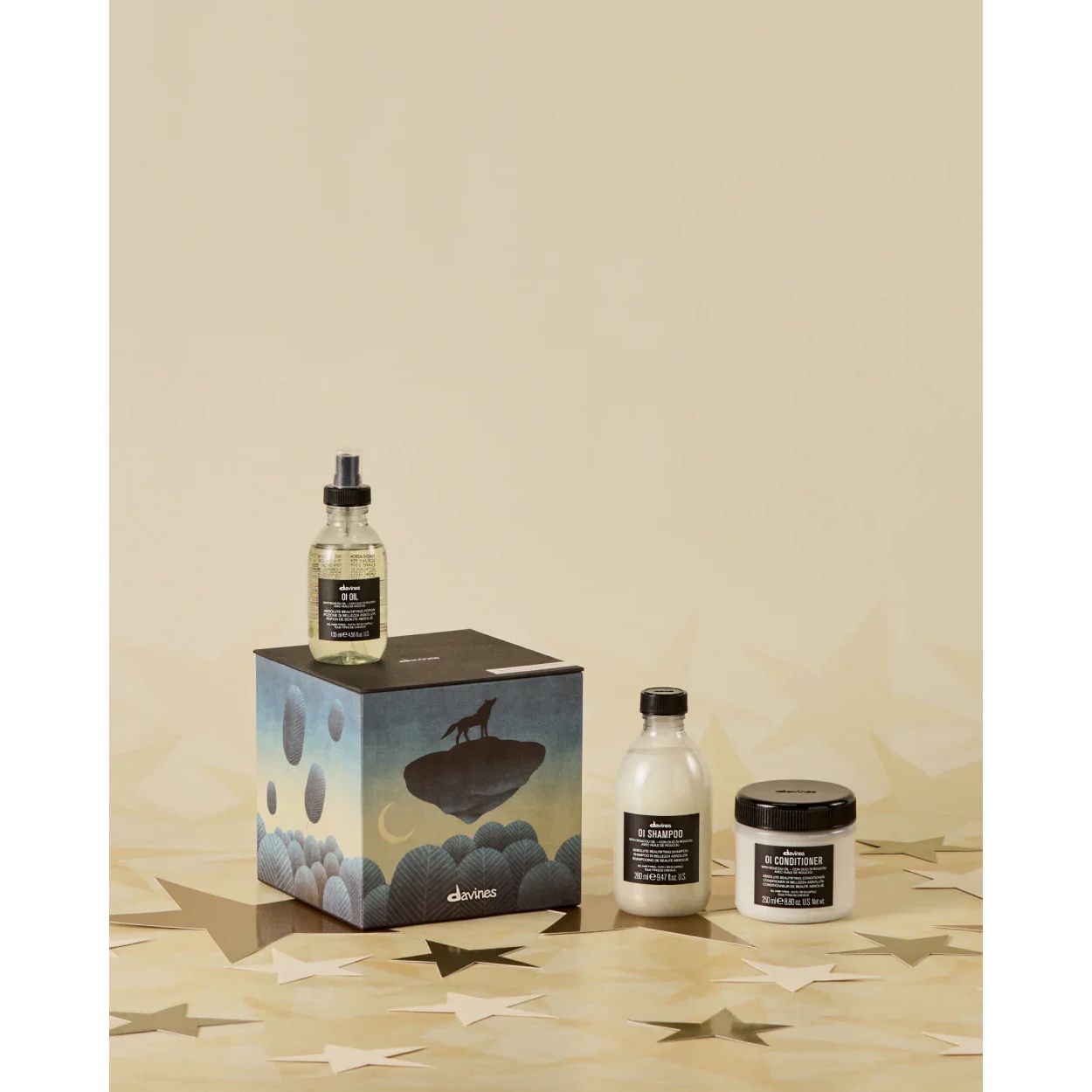 Davines Precious Temperate Forest haircare set with shampoo, conditioner, oil and gift box on gold star background, available at Goldfarmaci.
