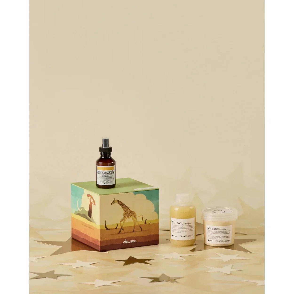 Davines Radiant Savanna haircare set with shampoo, conditioner and oil on giraffe box, Goldfarmaci