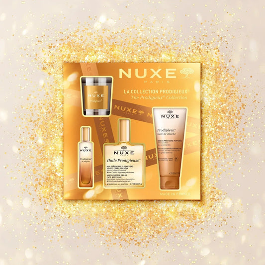 Nuxe Prodigieux Collection skincare set on gold sparkling background at Goldfarmaci online pharmacy