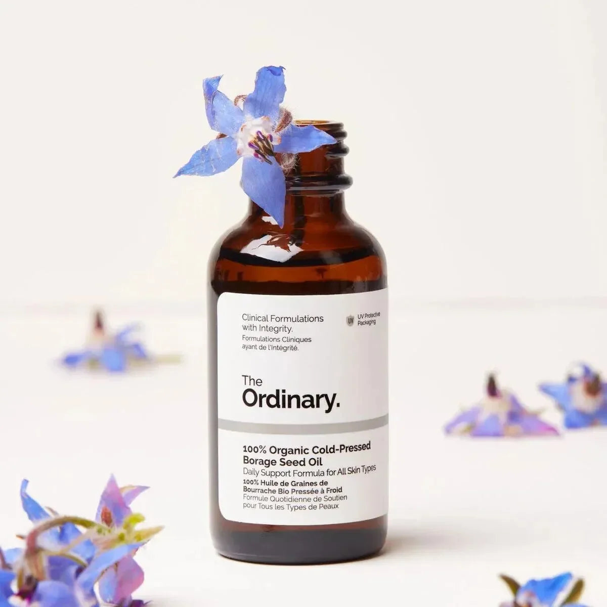 The Ordinary 100% Organic Cold-Pressed Borage Seed Oil bottle with blue borage flowers, skincare product from Goldfarmaci.