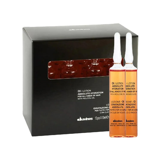 Davines OI Lotion ampoules and black box packaging for absolute hair hydration
