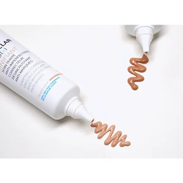 La Roche-Posay Effaclar Duo Unifiant skincare cream tube with beige product swatch on white